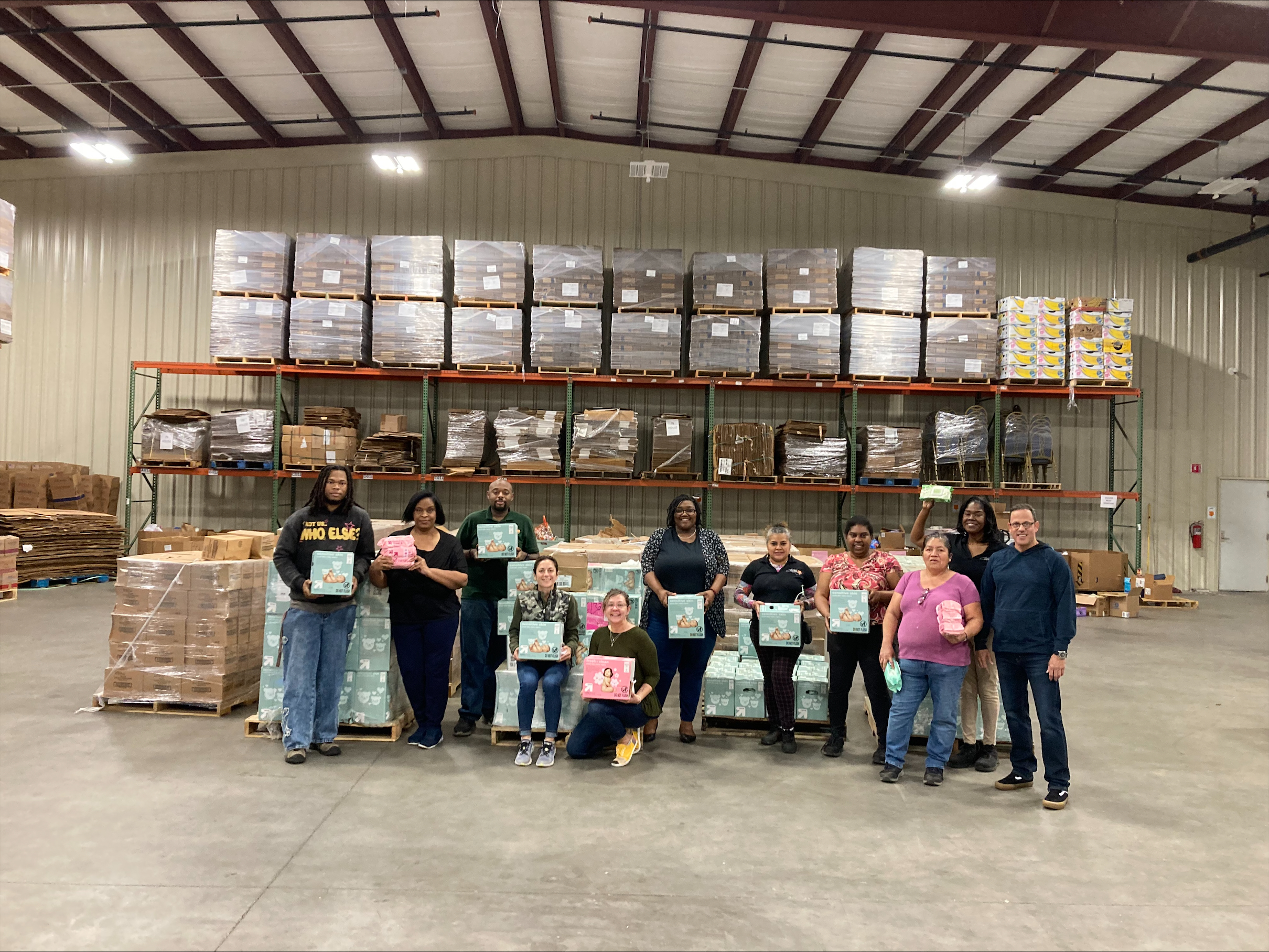 Volunteers distributing supplies for Shredding Hunger